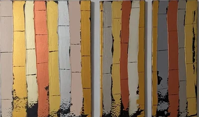 Three companion abstract paintings made from vertical cream, gold, copper, and gray bands.